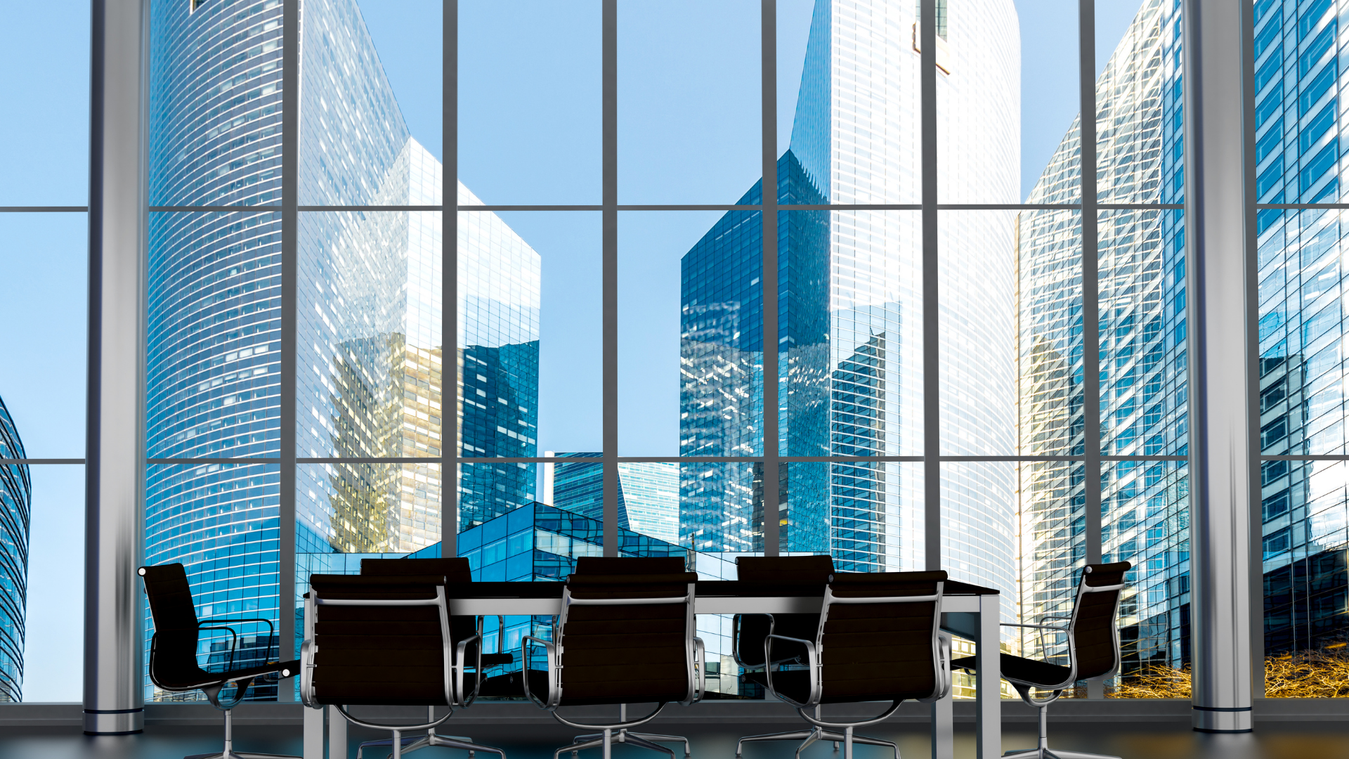 Stock image of conference table with a view outside of skyscrapers