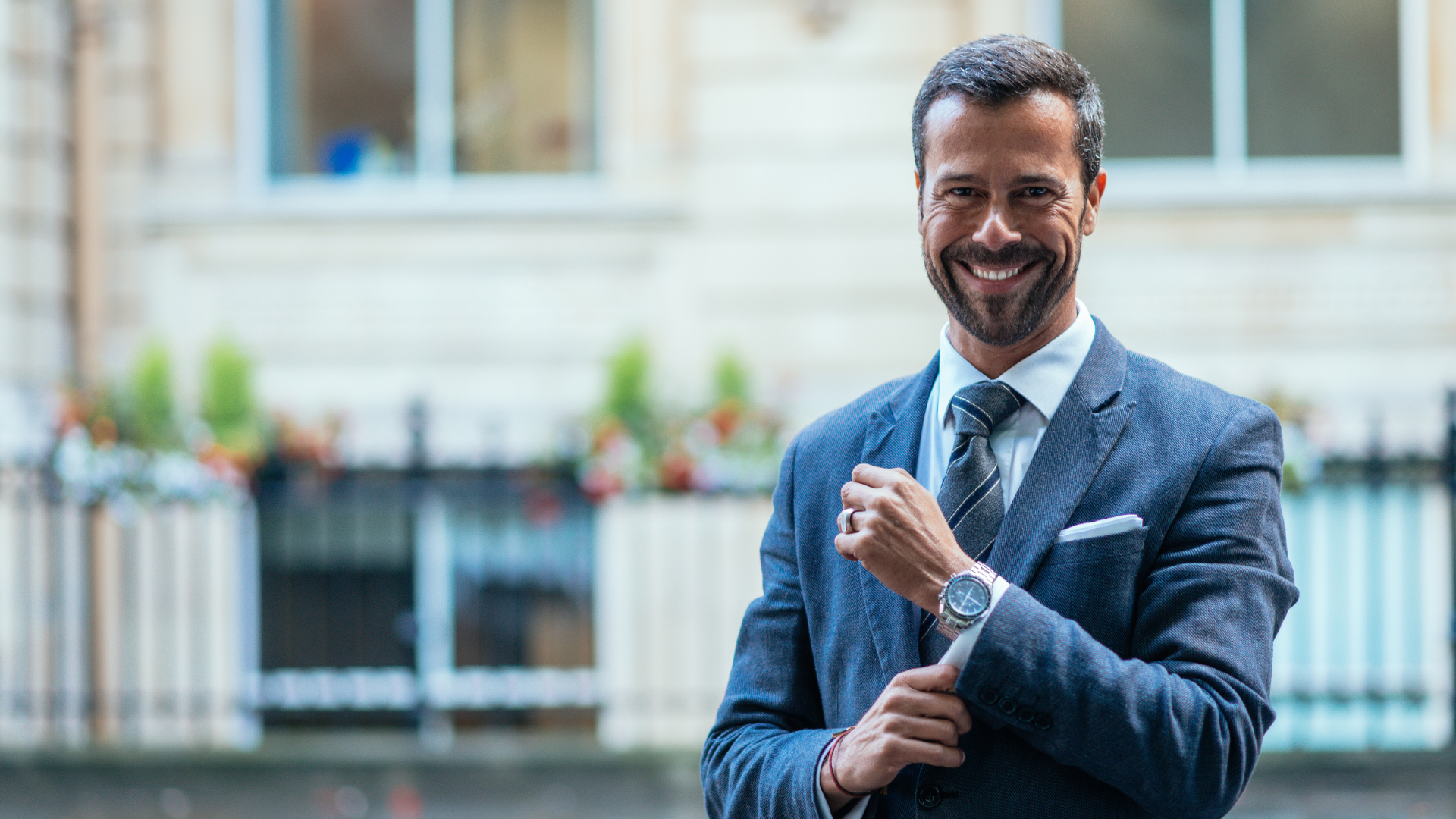 Image is of a professional male in a business suit smiling at the camera. Thumbnail is to convey to advisors how they can attract high net worth clients